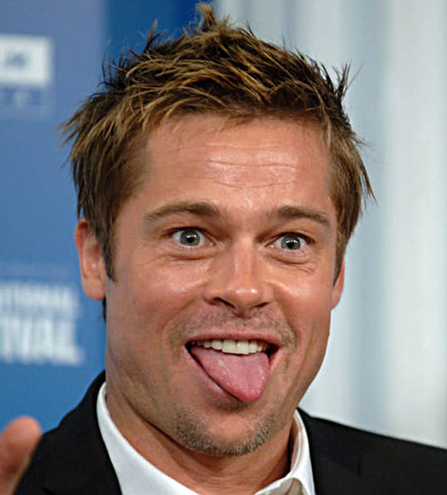 Brad Pitt hams it up for the cameras at a Toronto International Film 