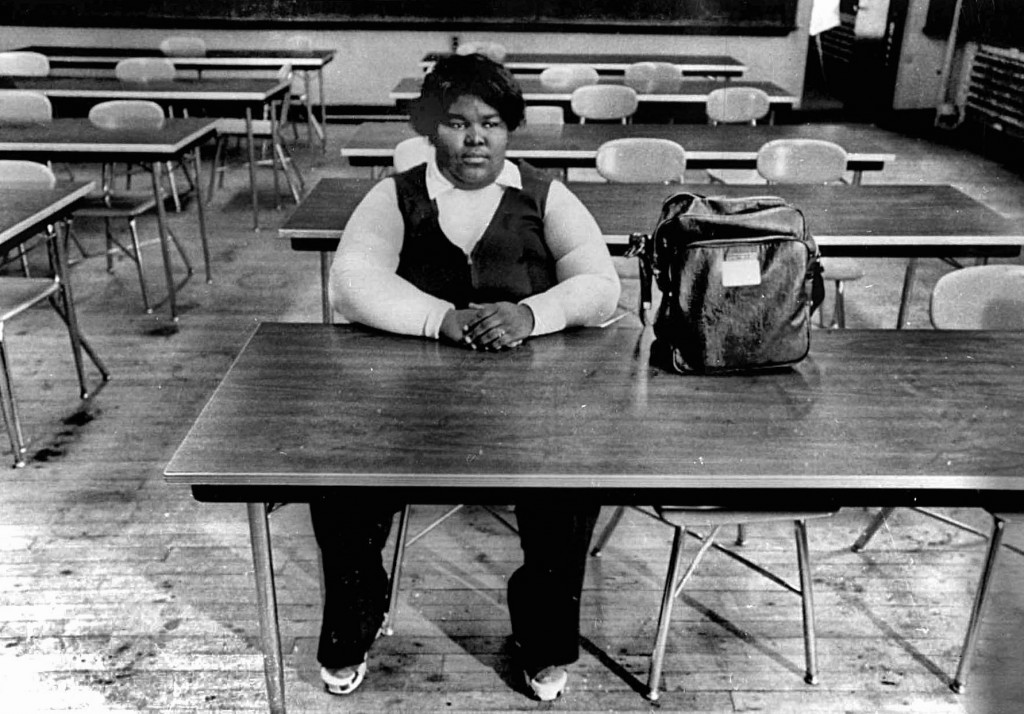 A lone black student sits in classroom of South Boston High School in fall  in Boston, MA, in 1974 during forced busing to racially integrate schools. White students boycotted the school for several months. Peter Bregg/AP